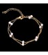 Bracciale doppia catena dorato con perline bianche