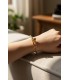 Bracciale in acciaio "Chiodo" dorato con strass