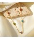 Collana in acciaio dorata con piccoli fiori cubic zirconia